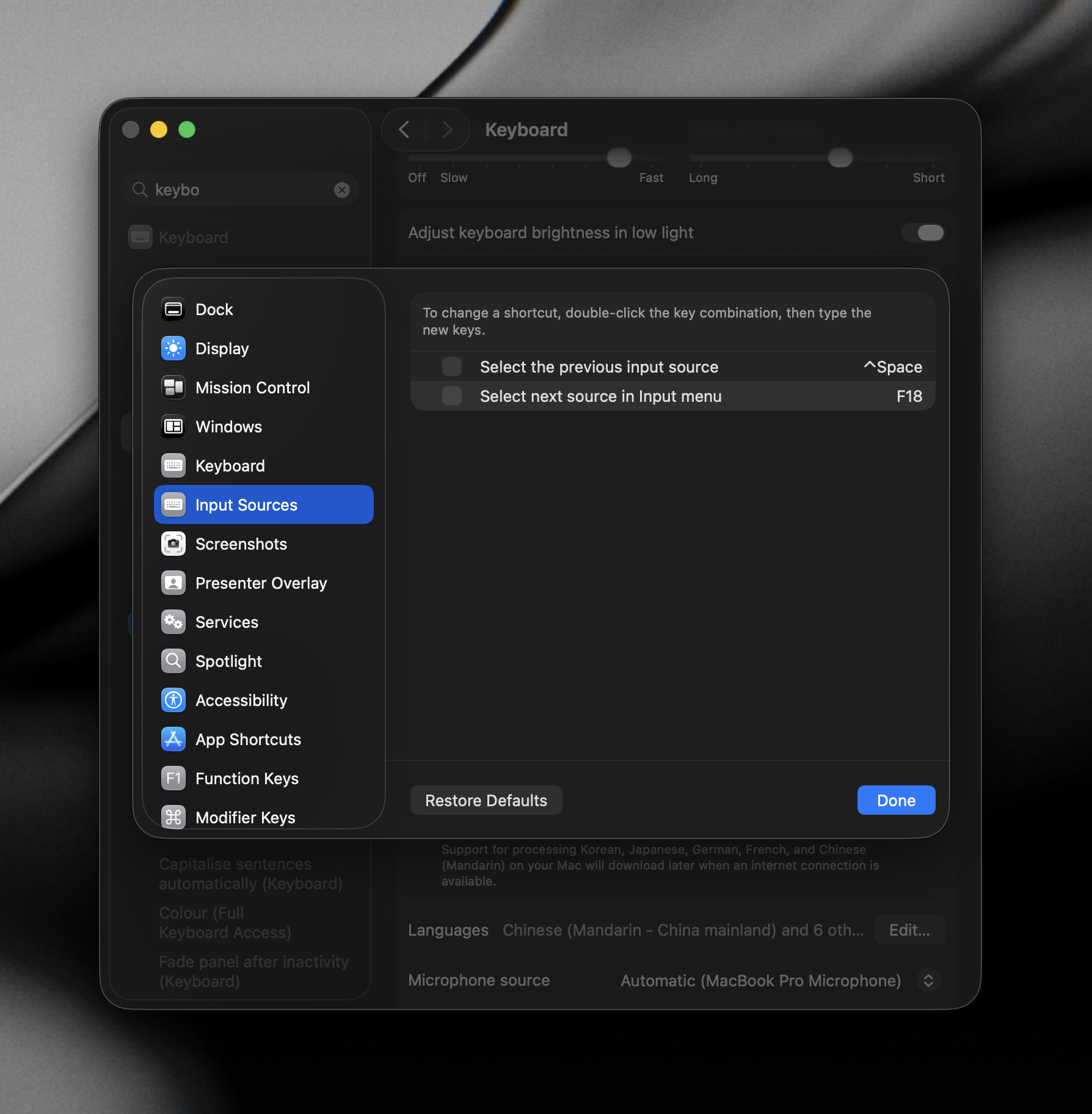 Screenshot of System Settings showing the Input Sources keyboard shortcut being changed